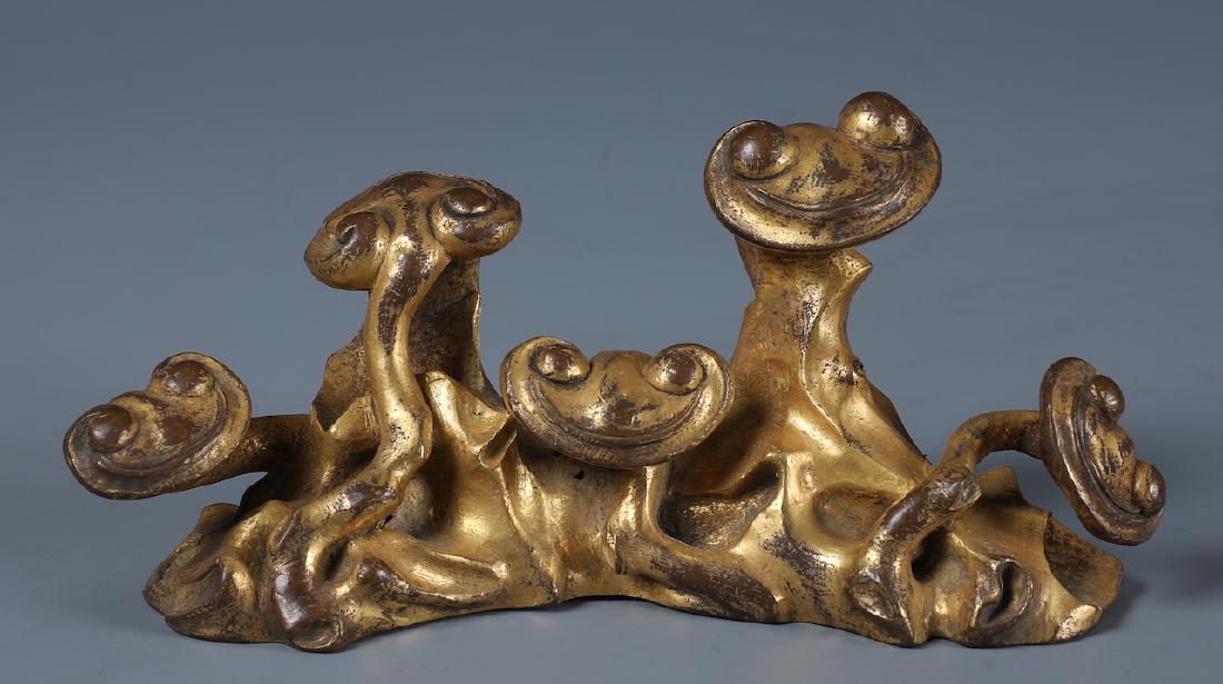 A CHINESE GILT BRONZE RUYI FORM BRUSH REST (1 of 8)