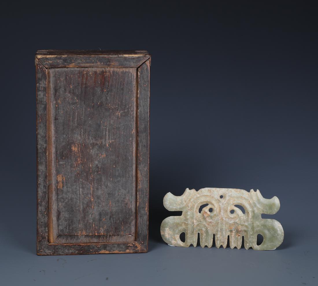 A VERY RARE CELADON JADE TOOTHED ANIMAL MASK ORNAMENT (1 of 5)