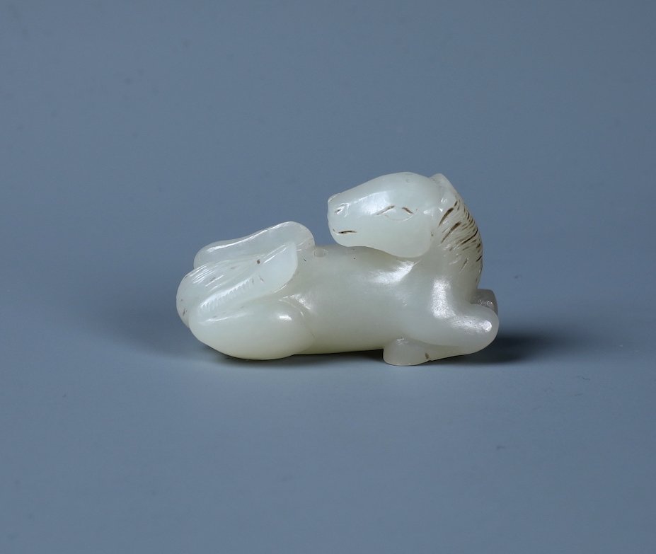 A FINELY CARVED MINIATURE JADE HORSE (1 of 4)