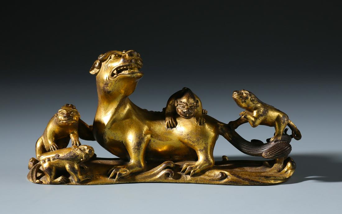 A Rare Chinese Carved Gilt Bronze Lion Brush Rest of (1 of 7)