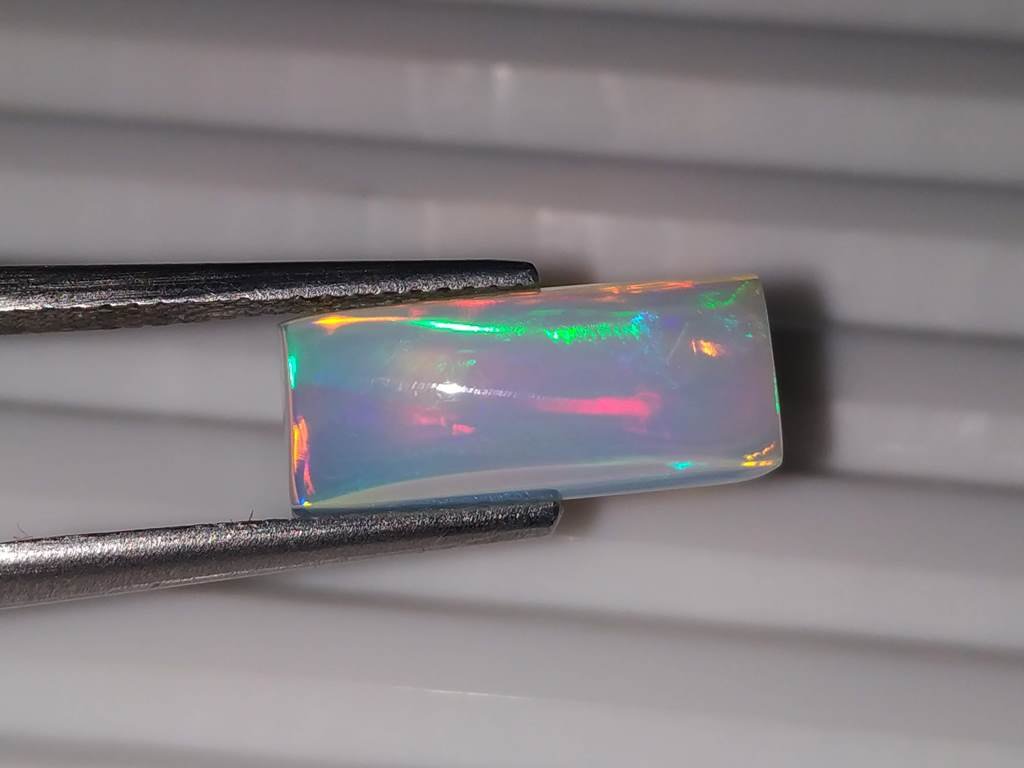 3.06 ctNatural Emerald Shape Fire Rainbow Opal Gemstone (1 of 2)