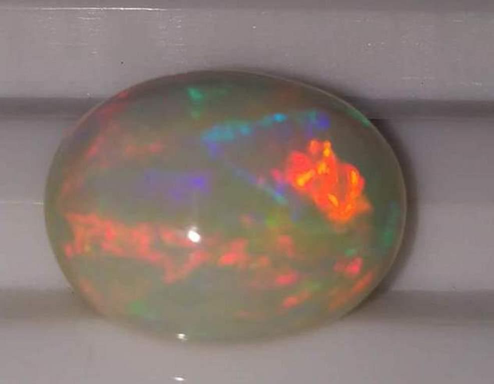 4.52 ct Natural Oval Fire Rainbow Opal Gemstone (1 of 1)