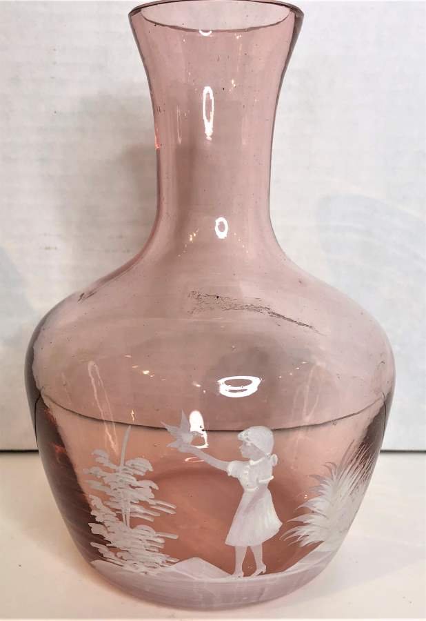 Mary Gregory Pink Glass Vase / Water Bottle Enamel Girl: Mary Gregory Pink Glass Vase / Water Bottle with white Enamel Girl.Size: 7 in. height, 4.5 in. wide.