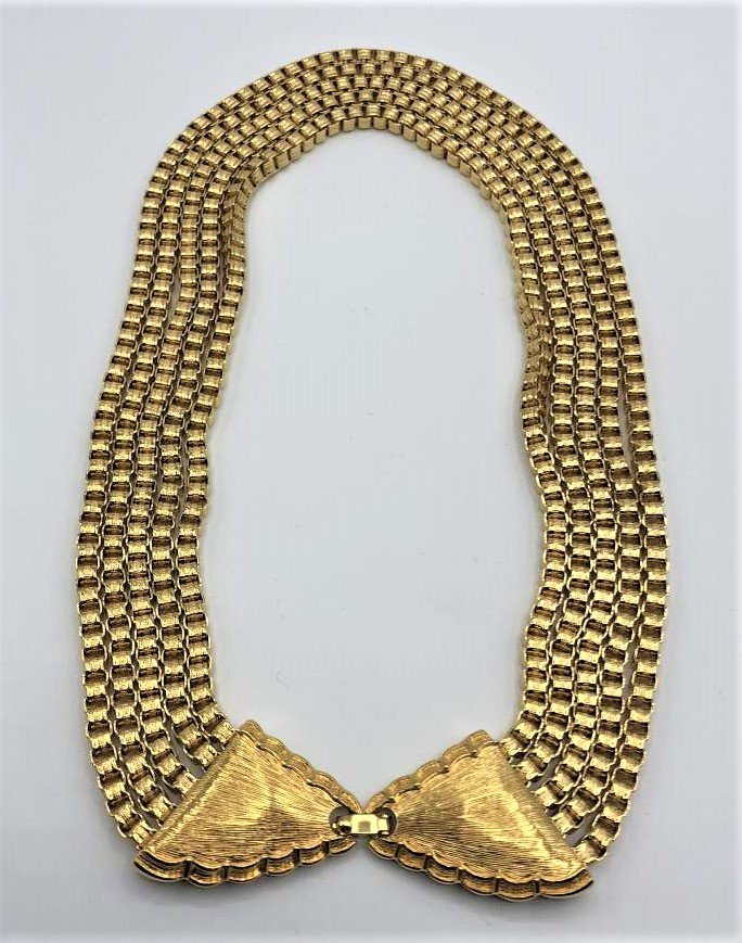 MONET Gold Tone 5-Strand Necklace: MONET Gold Tone 5-Strand Necklace. Size: 18 in. length, 1 1/4 in. wide
