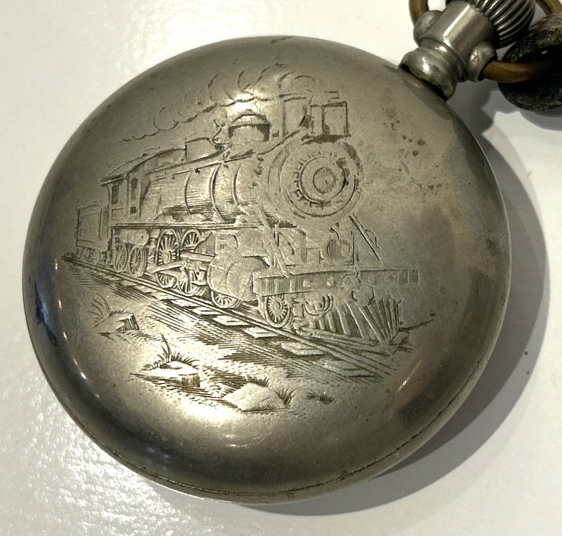 Antique Railroad Pocket Watch, HW, Philadelphia Watch Case, Silverode 17 Jewels, Working: Antique Railroad Pocket Watch, HW, Philadelphia Watch Case, Silverode 17 Jewels, Working. Size 3 in. x 2 3.8 in. ; has a steam locomotive etched on case.