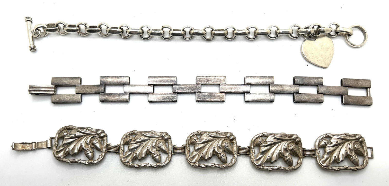 [3] Sterling Silver Bracelets 67.5 grams: .925 Heart Charm Toggle Closer Bracelet 8 in. x 3/4 in.; (1 of 3)