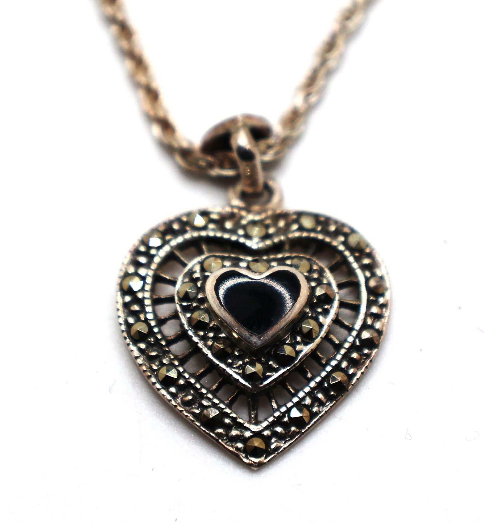 .925 Sterling Silver with Black Onyx and Marcasites Heart Pendant Necklace .925 Rope 20 in. Chain: .925 Sterling Silver with Black Onyx and Marcasites Heart Pendant 1 in. x 3/4 in. Necklace .925 Rope Twist 20 in. Chain