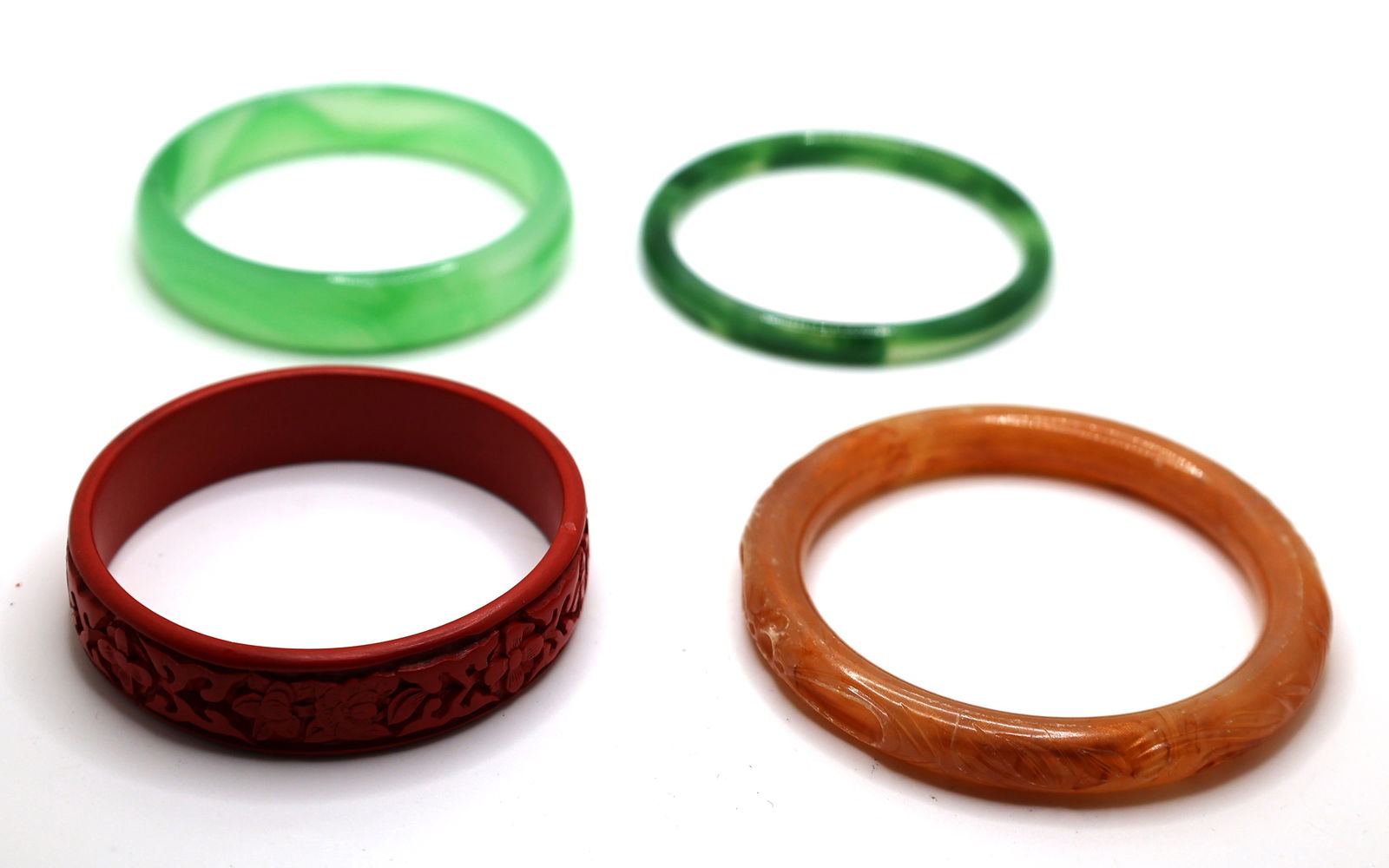 4 Assorted Bangles: Carnelian Agate 3 1/2 in. x 1/2 in.; Green Chalcedony 3 in. x 1/4 in.; (1 of 2)
