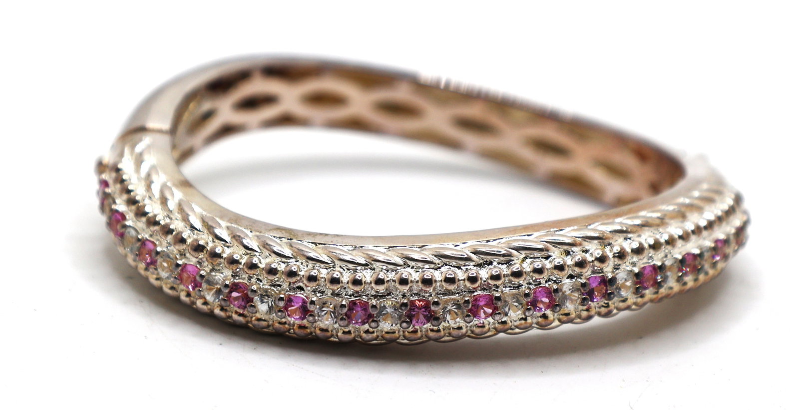 .925 Sterling Silver 62.7 grams Judith Ripka Wave Bangle with Clear Clear Purple Amethyst: .925 Sterling Silver 62.7 grams Judith Ripka Wave Bangle with Clear Clear Purple Amethyst size 3 in. x 2 1/2 in. x 1/2 in.