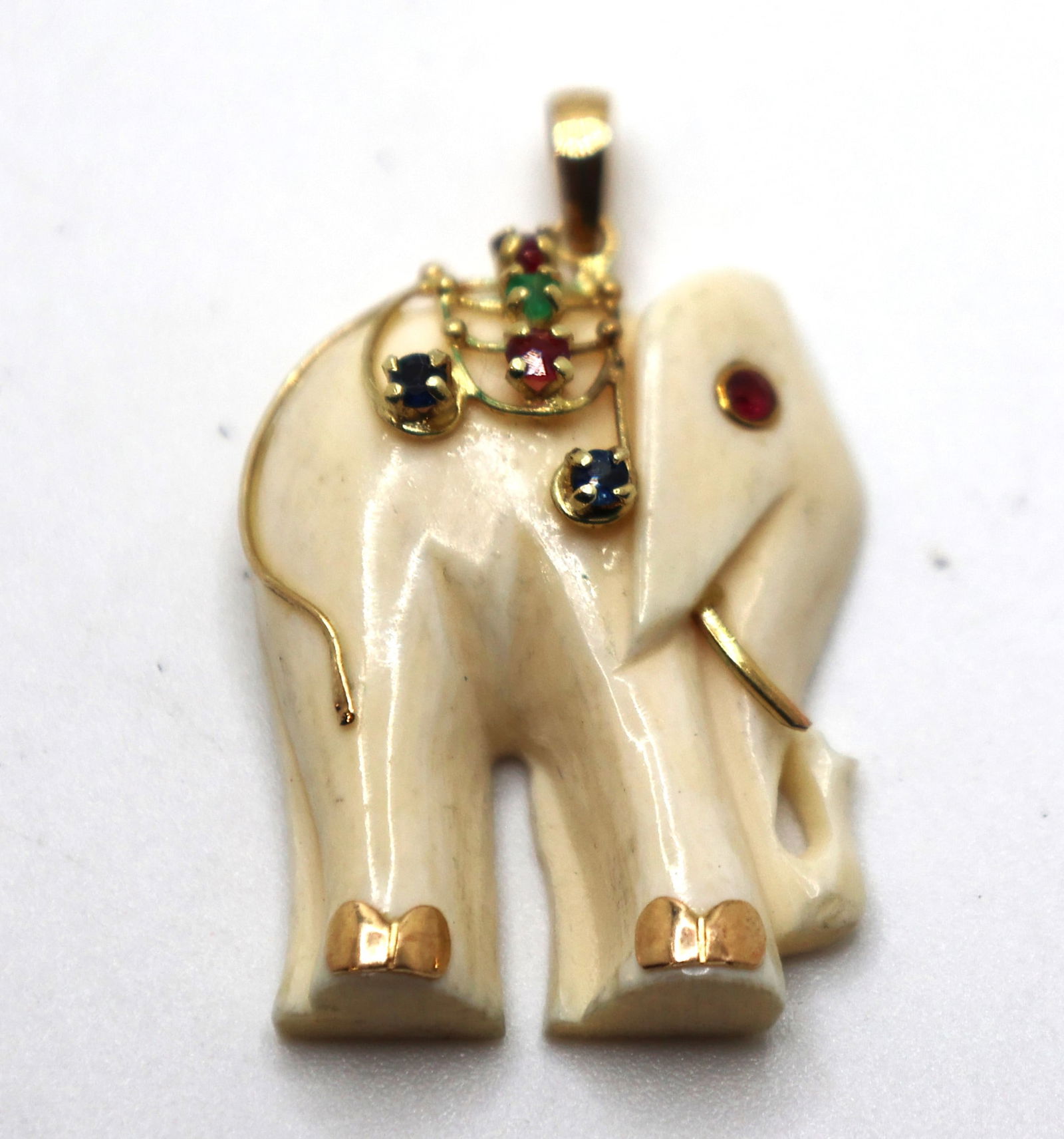 14K Gold 585 Bone Elephant Figural Pendant with Ruby Eye, Sapphire Ruby Emerald Gem Saddle: 14K Gold 585 Bone Elephant Figural Pendant with Ruby Eye, Sapphire Ruby Emerald Gem Saddle 1 1/2 in. x 1 in.
