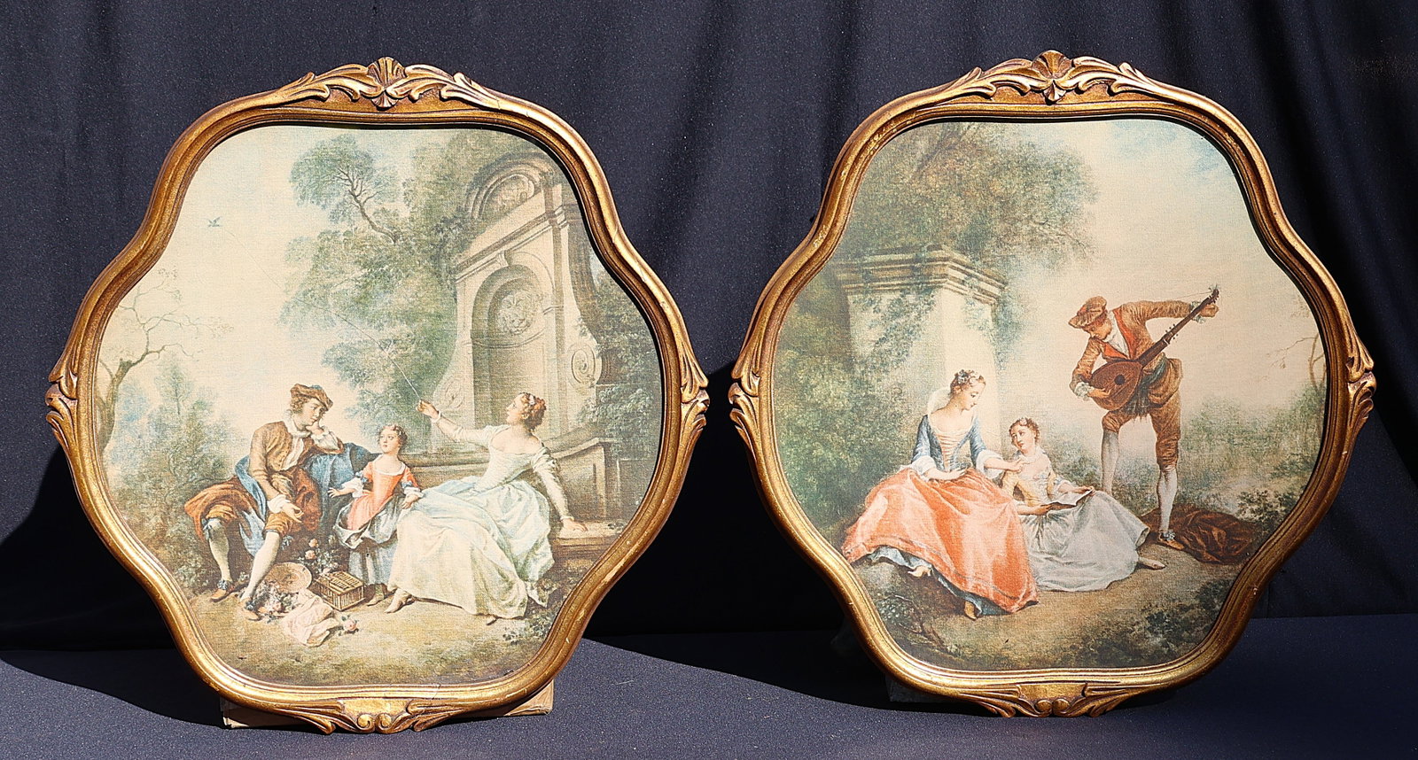 Pair French Circa 1920s Color Prints Genre Courting Scenes in Shaped Gold Frames: Pair French Circa 1920s Color Prints Genre Courting Scenes in Shaped Gold Frames. Size: Image 18 in. x 18 in. ; outer frame 22 in. x 21 in.
