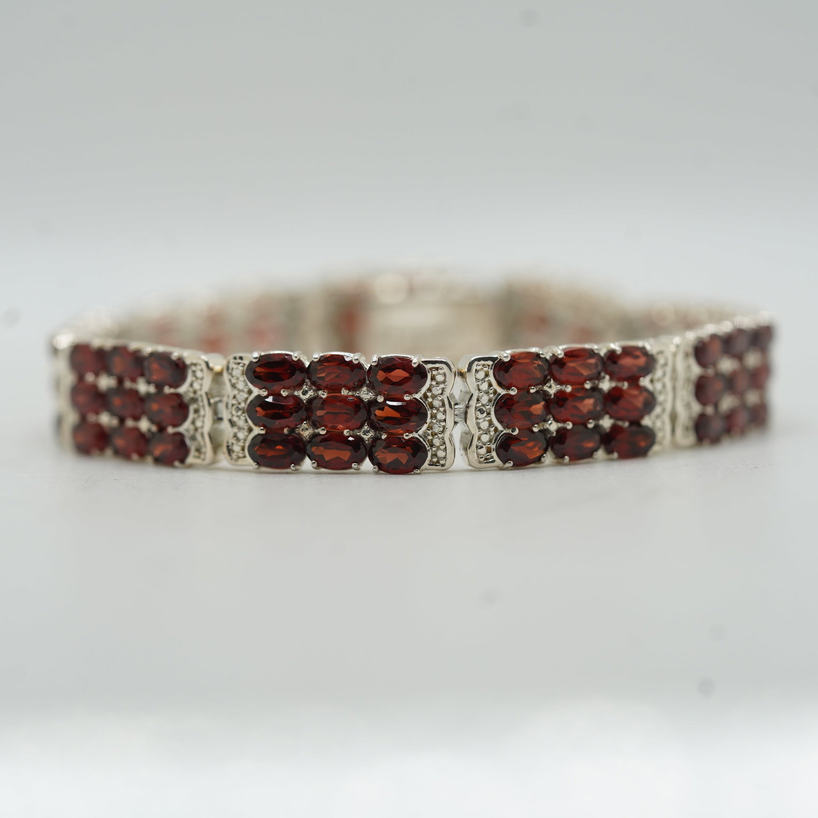 M-925 Sterling Silver w/ Garnets Tennis Bracelet: 7 x 3/8