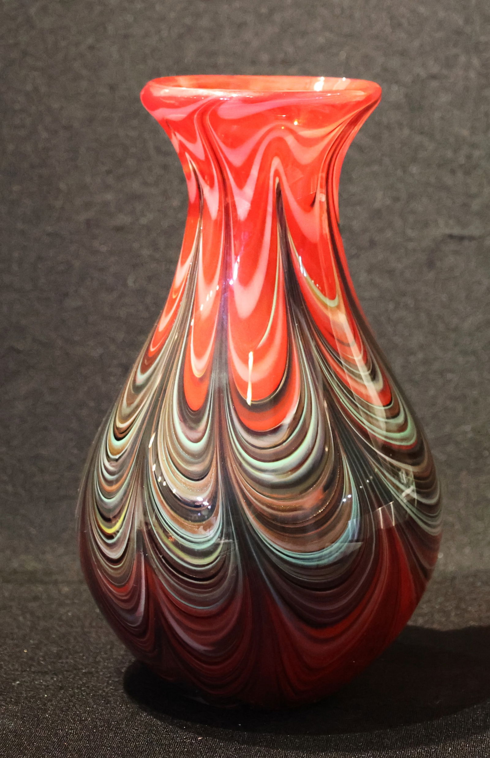 Colorful Murano Art Glass Vase, Featuring A Swirling Design In Red, Black, White, And Light Blue.: Colorful Murano Art Glass Vase, Featuring A Swirling Design In Red, Black, White, And Light Blue. ; Size: 11 inches Height x 6 1/2 in.wide; top is 4 inches diameter
