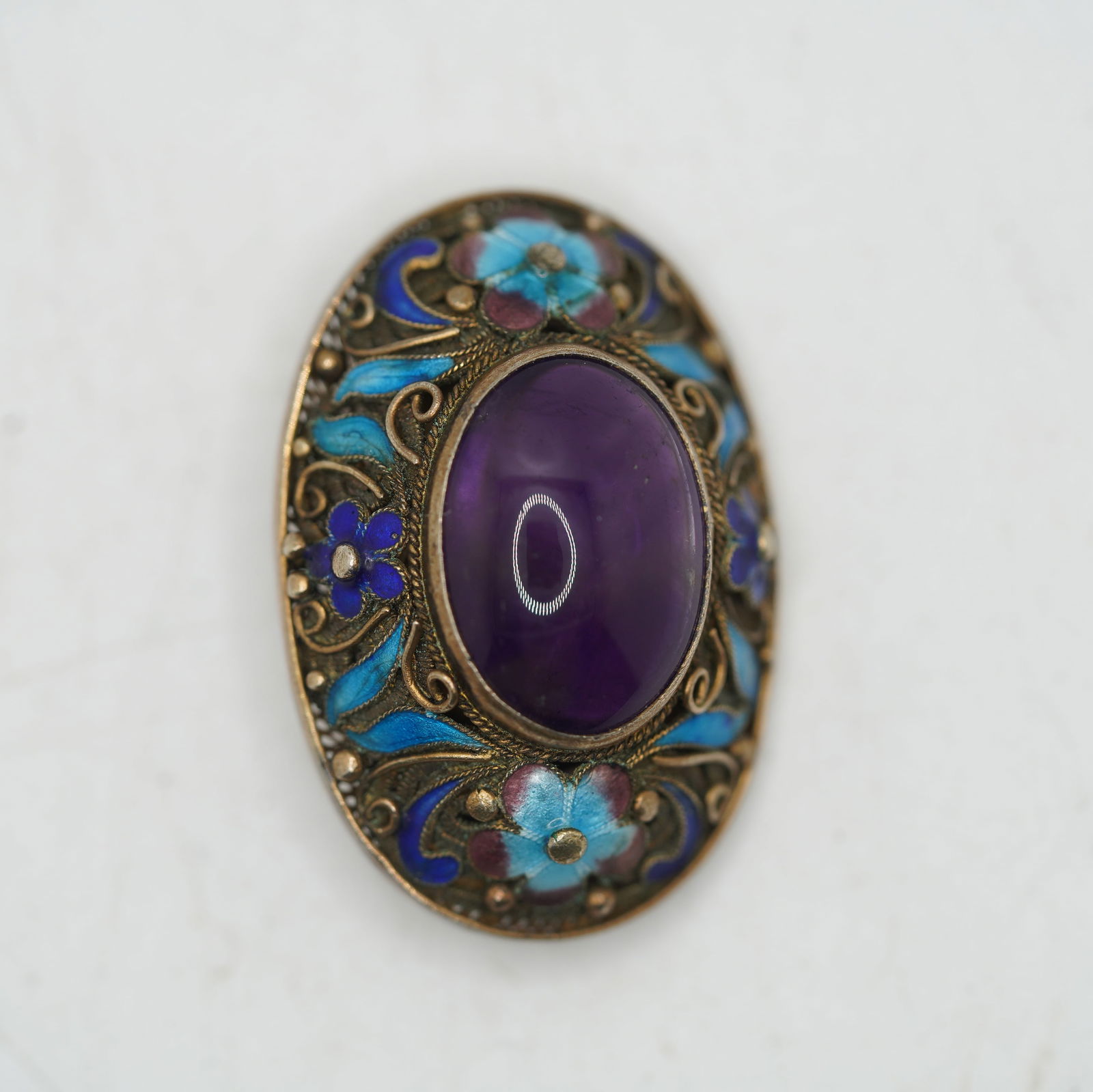 Tests Sterling Purple Amethyst Center Stone with Elaboate Filigree Setting Blue Enameld Pin: Tests Sterling Purple Amethyst Center Stone with Elaboate Filigree Setting Blue Enameld Flowers Pin, size 1 1/2 in. x 1 in.