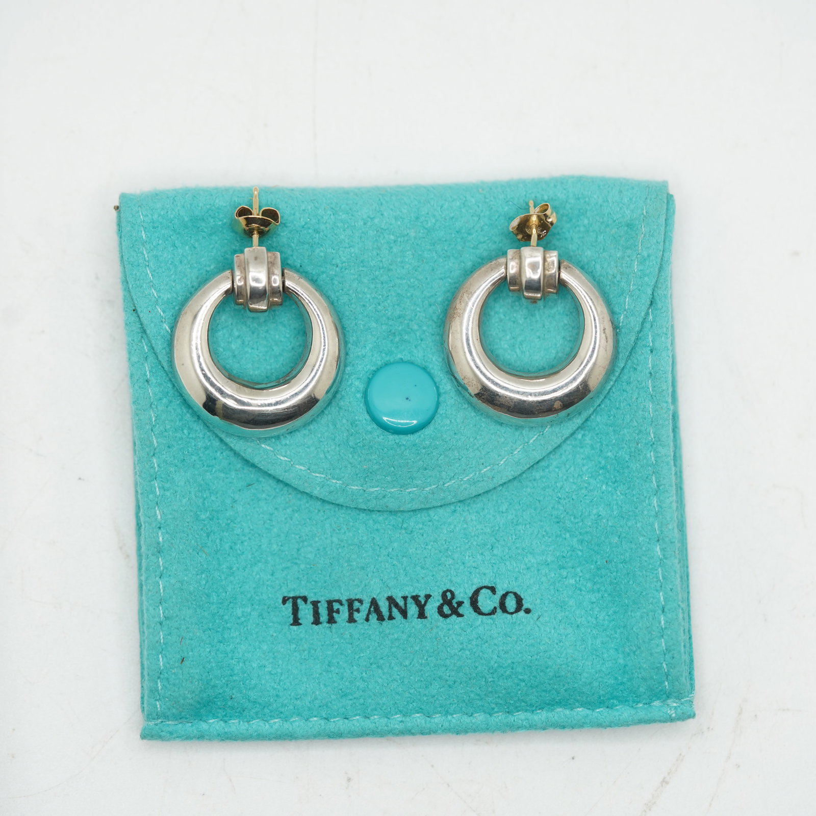 Tiffany & Co. Sterling Silver and 14K Gold Hoop Earrings in Box: Tiffany & Co. Sterling Silver and 14K Gold Hoop Earrings in Box.Size: 7/8 in. x 1 1/8 in.