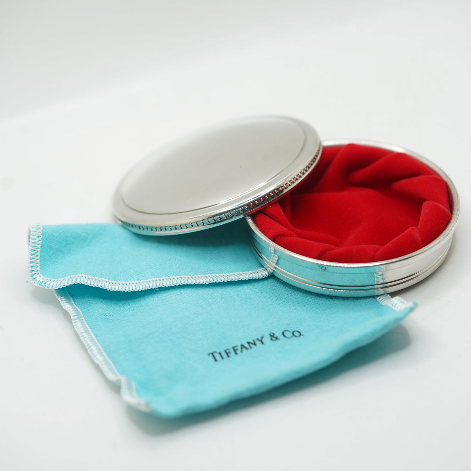 Tiffany & Co .Handcrafted Pewter Round Trinket Box 3 1/4 in. x 3/4 in. with Fabric Pouch & Box: Tiffany & Co .Handcrafted Pewter Round Trinket Box 3 1/4 in. x 3/4 in. with Fabric Pouch & Box
