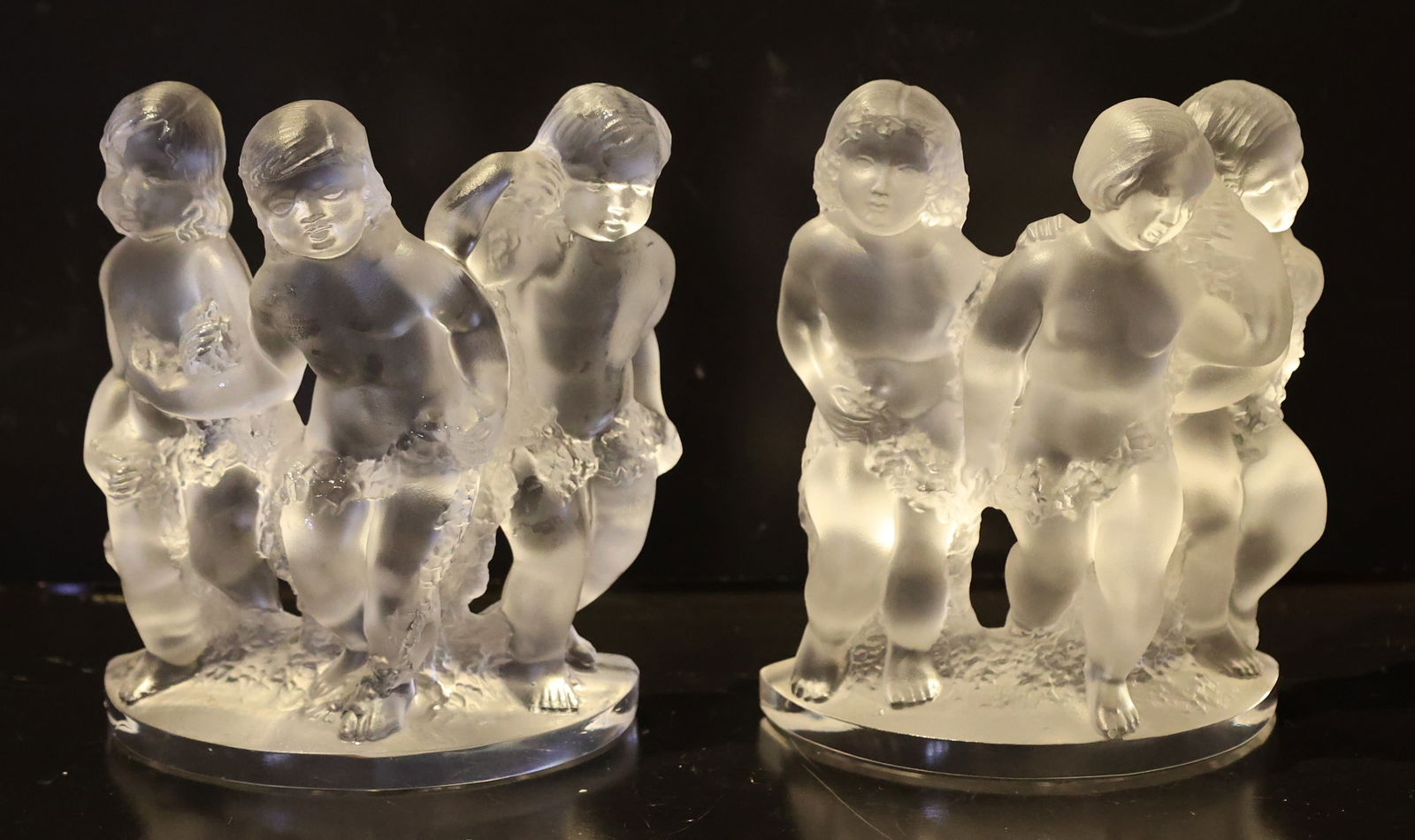 Lalique France Bookends Frosted Crystal "Luxembourg" Sculptures Broups of Cherubs: Lalique France Bookends Frosted Crystal "Luxembourg" Sculptures Broups of Cherubs; Size: 8 inches height x 6.5 inches wide x 3.25 inches depth.; frosted crystal "Luxembourg" sculptures by Lalique, fea