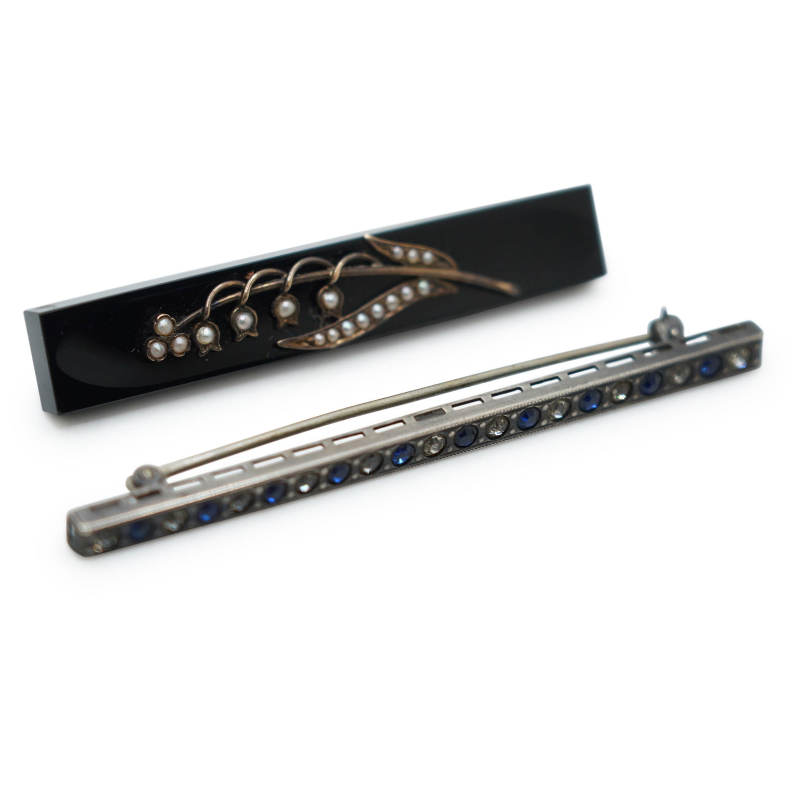 [2] Victorian Sterling Silver Bar Pin With Blue / Clear Rhinestones, Test 10K Back and 10K Lily of: [2] Victorian Sterling Silver Bar Pin With Blue / Clear Rhinestones 3 in. x 1/8 in. ,and other pin Test 10K Back and 10K Lily of the Valley Stem with genuine salt water pearls on blackm onyx bar. 2 1/