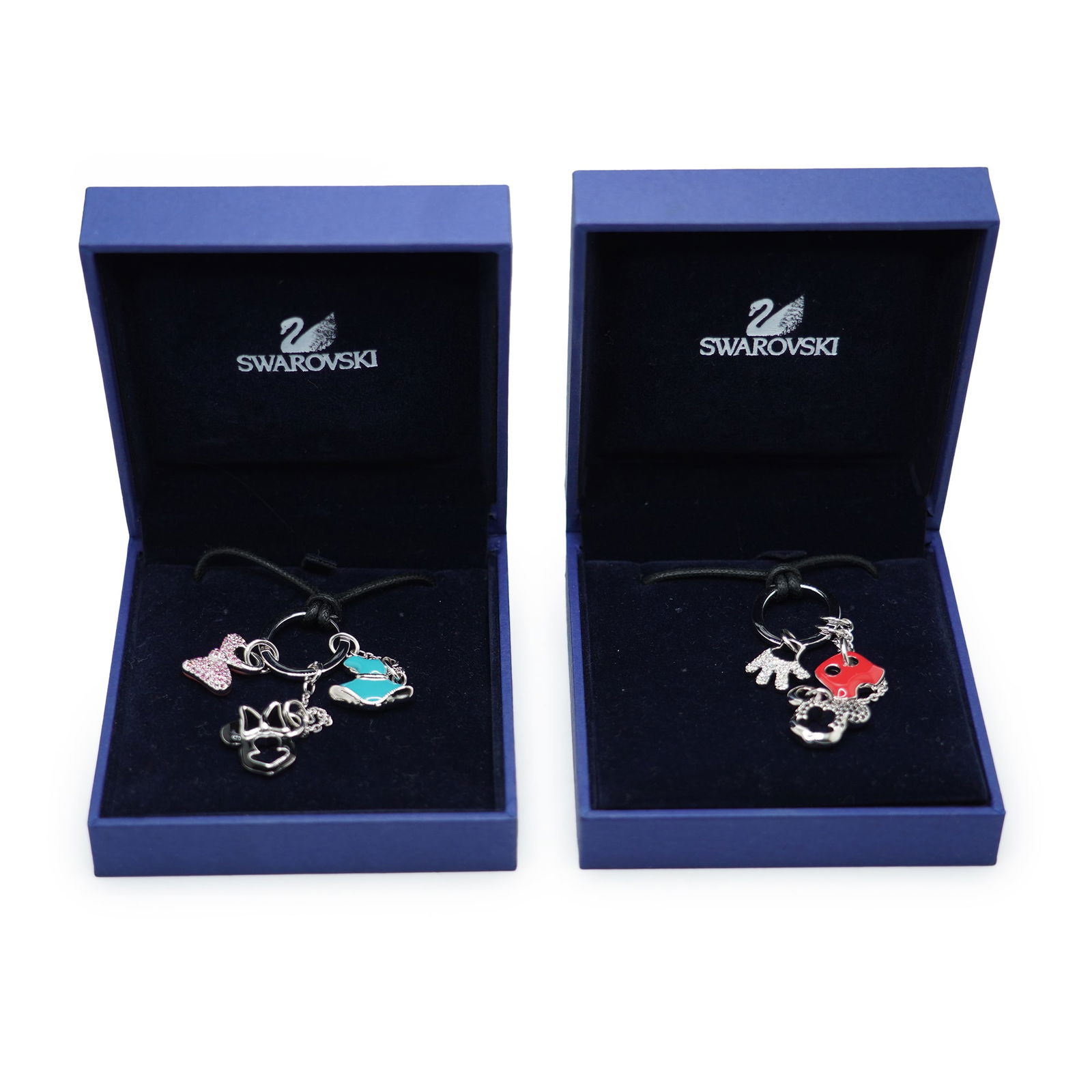 2 Swavrowski Disney Necklaces and Charms, Mickey and Minnie, in Original Boxes: 2 Swavrowski Disney Necklaces and Charms, Mickey and Minnie, in Original Boxes. Box size: 3 3/8 in. x 3 5/8 in. x 1 1/4 in.