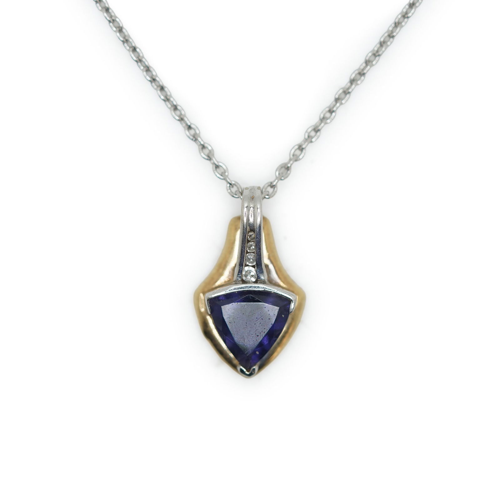 4.03 Grams Total Weight 14K and 10K Tanzanite with 4 Graduated Diamonds Pendant Necklace: 4.03 Grams Total Weight 14K and 10K Tanzanite with 4 Graduated Diamonds Pendant Necklace on a 16 in. Sterling Silver Chain