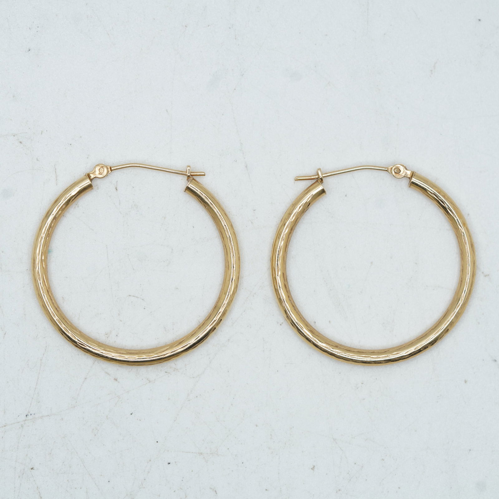 0.84 DWT, 10K Gold Engraved Hoop Earrings 1 1/8 in. Diameter (1 of 6)
