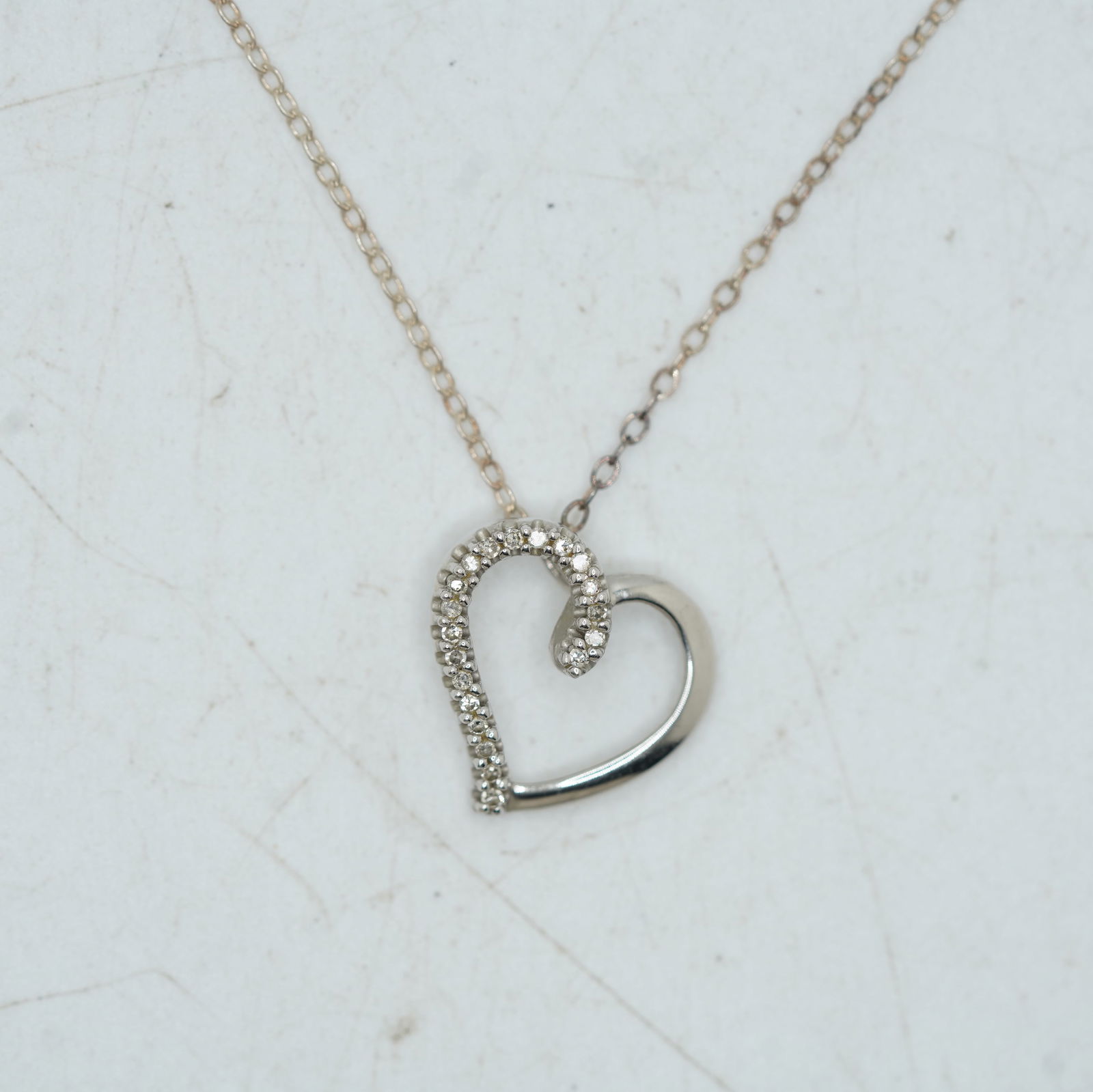 1.29 DWT, 10K Gold and Diamonds Heart Pendant Necklace on Sterling Silver 16 inch Chain: 1.29 DWT, 10K Gold and Diamonds Heart Pendant Necklace on Sterling Silver 16 inch Chain.