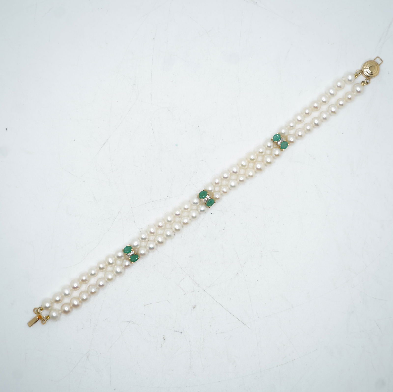 14K Gold 2-Strand Genuine Freshwater Cultured Pearls Spaced With 6 Emeralds and 6 Diamonds: 14K Gold 2-Strand Genuine Freshwater Cultured Pearls Spaced With 6 Emeralds and 6 Diamonds Bracelet 7 1/2 in. x 3/8 in.