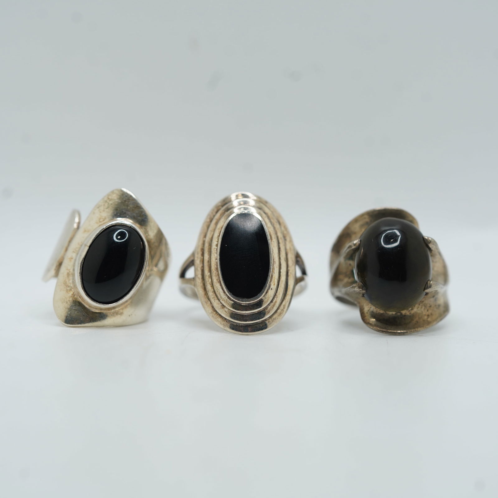 24.45 Grams Total Weight .925 Sterling Silver 3 Rings: .925 Black Onyx Swirl Setting Ring Size 8.5;: 24.45 Grams Total Weight .925 Sterling Silver 3 Rings: .925 Black Onyx Swirl Setting Ring Size 8.5; .925 Black Onyx Surrounded By 4 Oval Frames Ring Size 10[ ATI Mexico .925 Mid-Century Modern With Bl