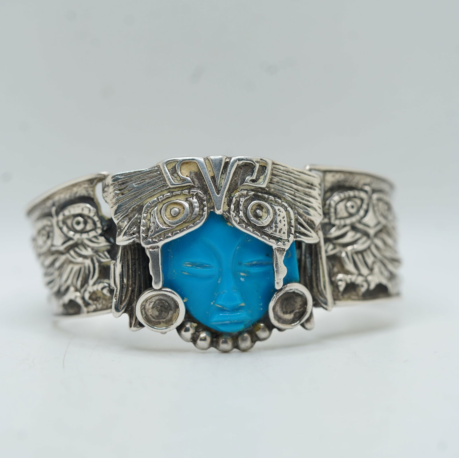 Native American Indian 71.79 Grams Sterling Silver Bracelet TD-35 Mexico Hand Engraved w/ Symbols: Native American Indian 71.79 Grams .925 Sterling Silver Bracelet TD-35 Mexico Hand Engraved w/ Symbols Feathers, Eyes Face. Size: 6 in. x 1 1/2 in.