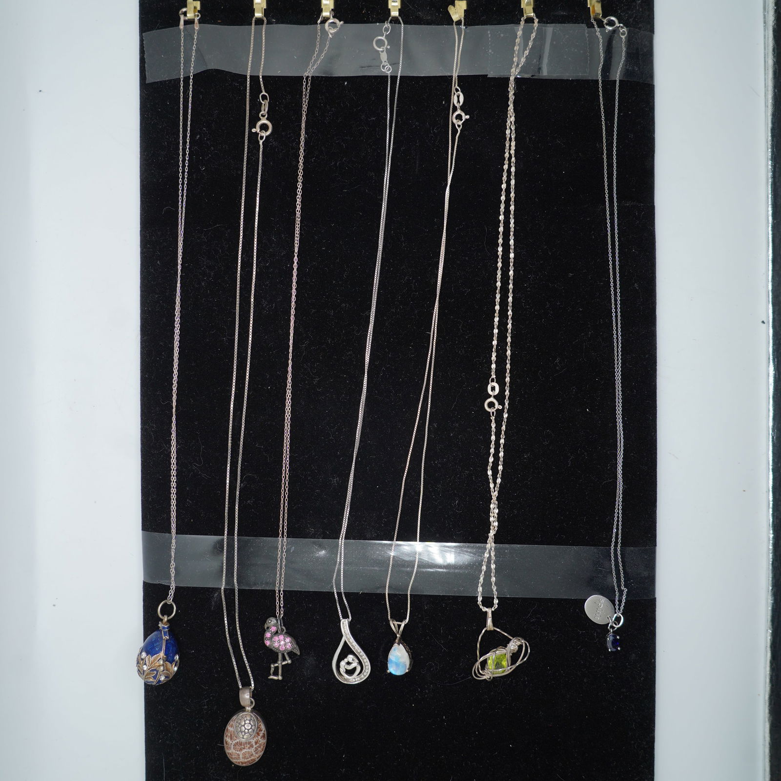 7 Assorted .925 Sterling Silver Pendant Necklaces: .925 Sterling Sapphire Pendant With .925 Sterling: 7 Assorted .925 Sterling Silver Pendant Necklaces: .925 Sterling Sapphire Pendant 1/4 in. x 1/4 in. With .925 Sterling Spirit Pendant 3/4 in. x 3/8 in. Necklace on .925 Sterling 18 n. Chain; .925 Ster