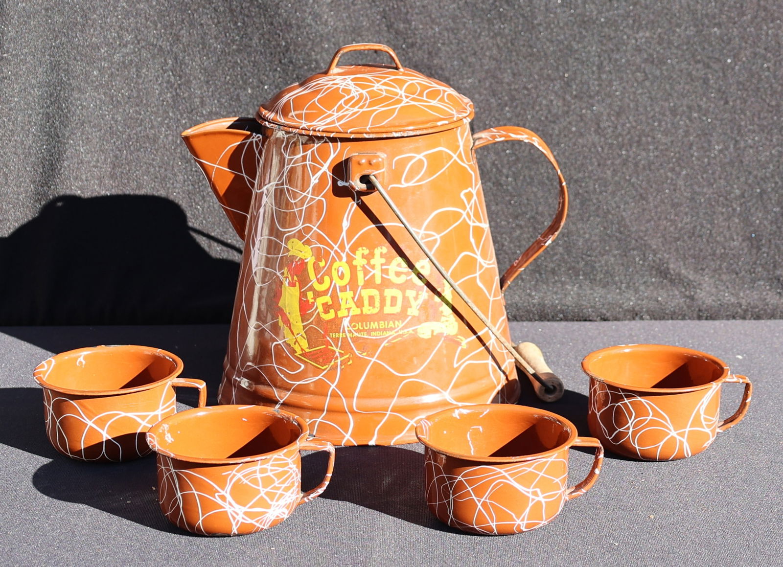 Vintage Enamelware Coffee Kettle Pot With 4 Coffee Mugs " Coffee Caddy" Columbia, Indiana USA: Vintage Enamelware Coffee Kettle Pot With 4 Coffee Mugs " Coffee Caddy" Columbia, Terrehaute, Indiana USA, Circa 1950s.