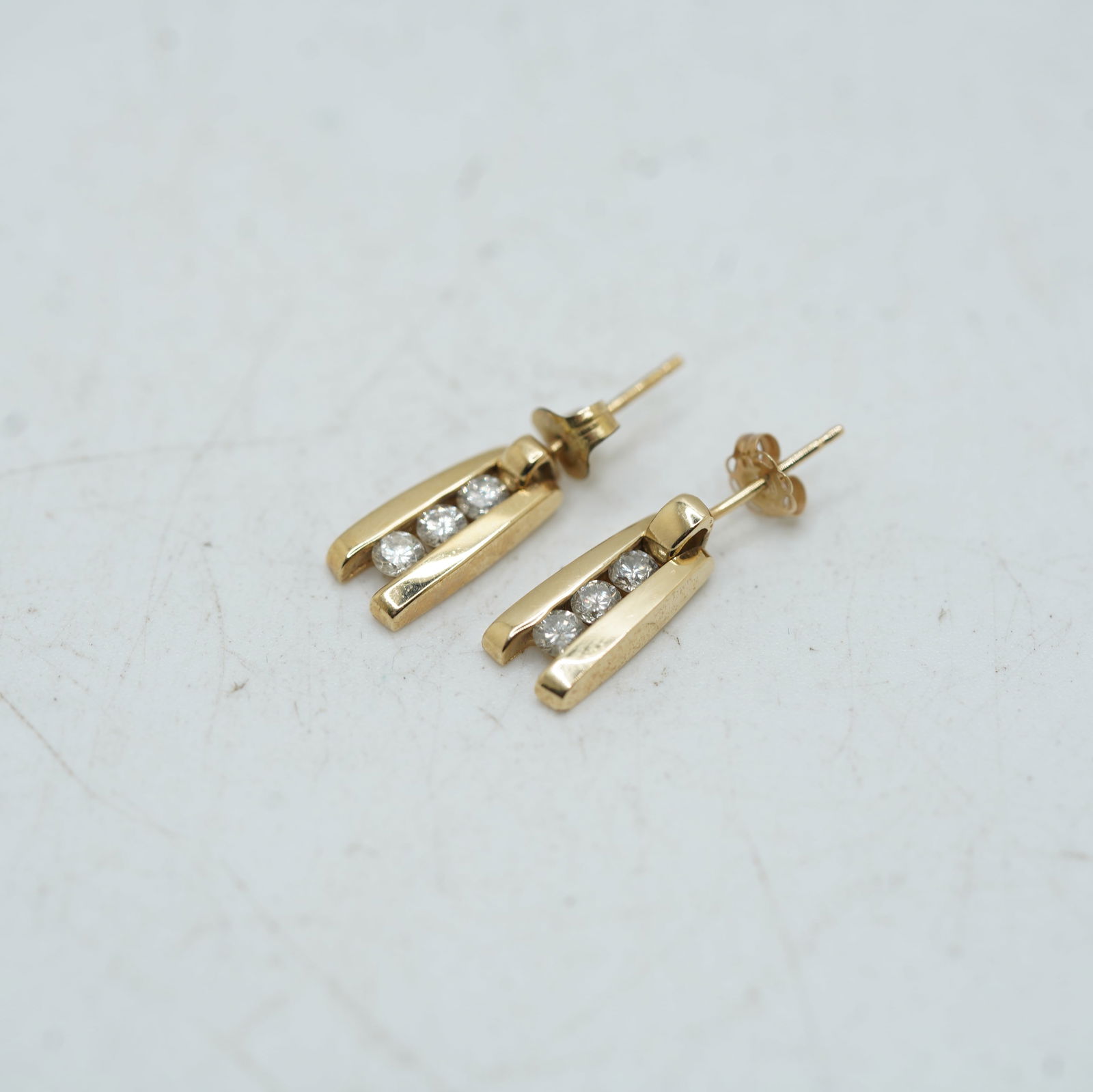 1.99 DWT 14K Yellow Gold 3 Diamonds Channel Setting Pierced Earrings 1/2 in. x 1/4 in. (1 of 9)