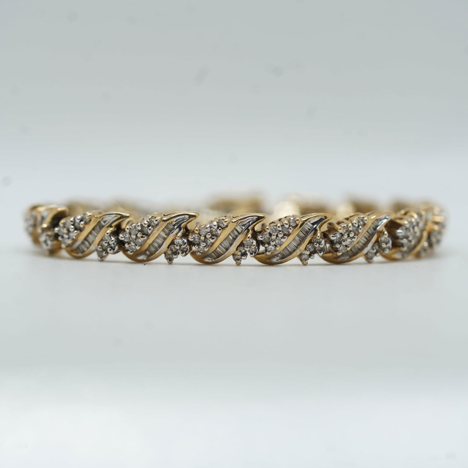 14.08 DWT 10K Yellow Gold Diamond Bracelet with Baguettes and Round Stones 7 1/4 in. x 1/4 in.: 14.08 DWT 10K Yellow Gold Diamond Bracelet with Baguettes and Round Stones 7 1/4 in. x 1/4 in.