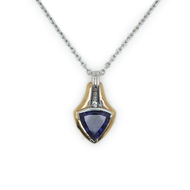 4.03 Grams Total Weight 14K and 10K Tanzanite with 4 Graduated Diamonds Pendant Necklace on a 16 in: 4.03 Grams Total Weight 14K and 10K Tanzanite with 4 Graduated Diamonds Pendant Necklace on a 16 in. Sterling Silver Chain