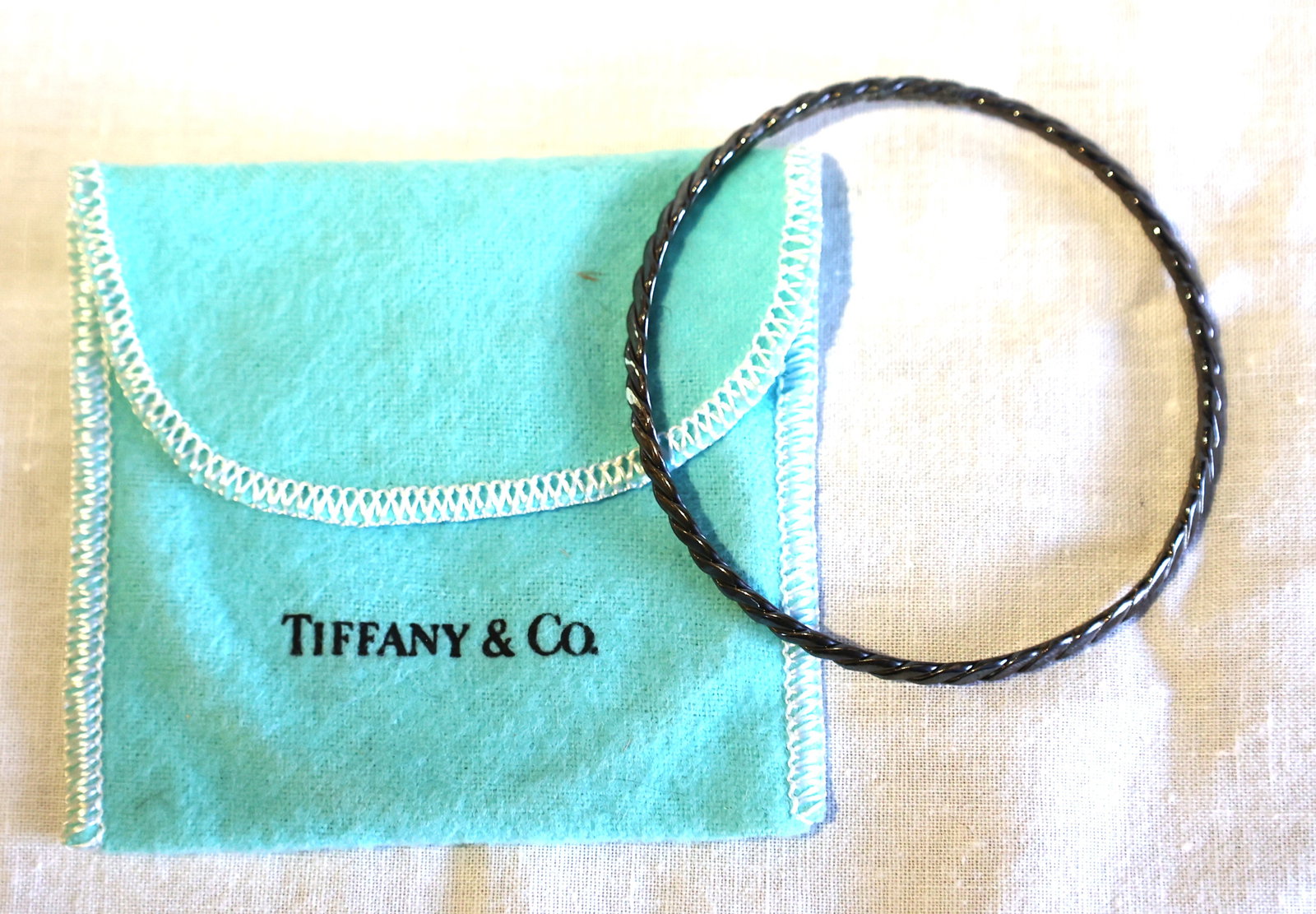 12.36 Grams TIFFANY & CO Sterling Silver Vintage Twist Bracelet 2 3/4 in. dia. with Fabric Pouch: 12.36 Grams TIFFANY & CO Sterling Silver Vintage Twist Bracelet 2 3/4 in. dia. with Fabric Pouch