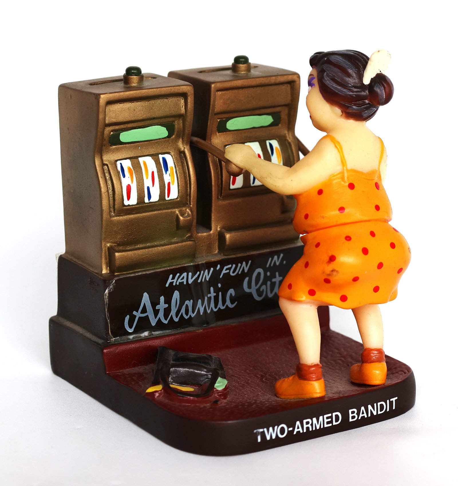 Vintage Rubber "Two-Armed Bandit" slot machine piggy bank featuring a woman in a polka-dot dress.The (1 of 10)