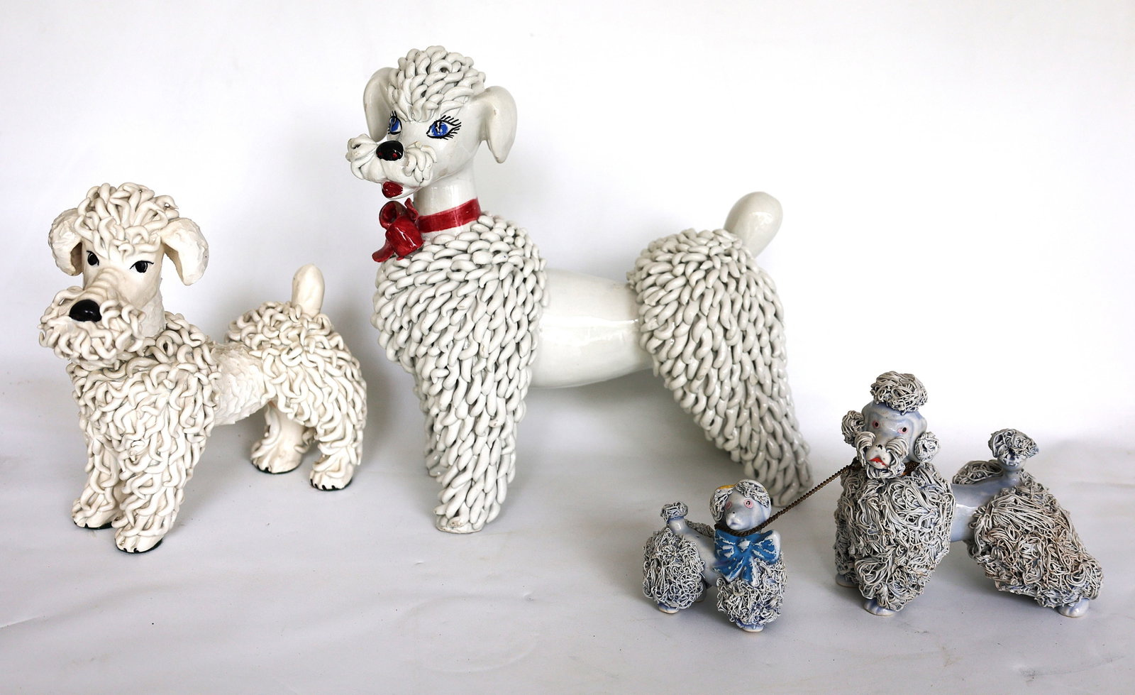 4 Assorted vintage poodle figurines are often referred to as "spaghetti poodles" (1 of 5)