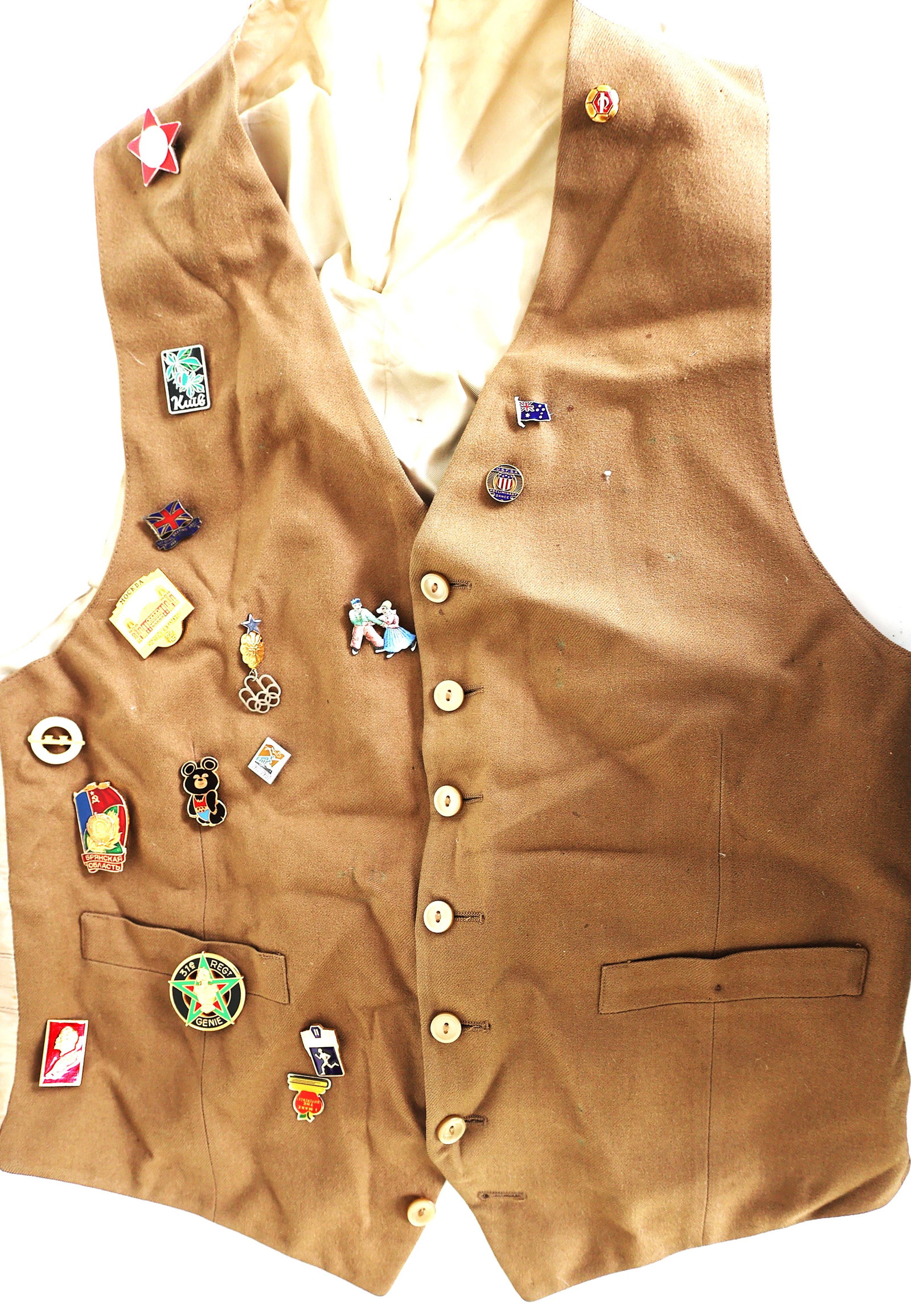 brown vintage vest appears to be a collectible item adorned with various pins and badges (1 of 7)