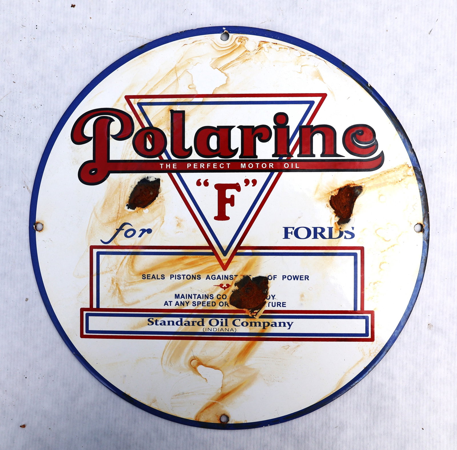 vintage Polarine for Fords porcelain sign features red and blue text on a white circular background (1 of 3)