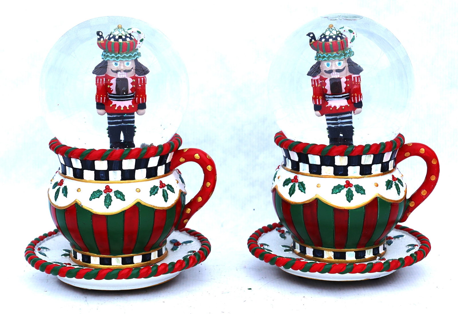 Mackenzie-Childs Teapot Nutcracker Musical Snow Globes featuring hand-painted nutcrackers in teacup (1 of 6)