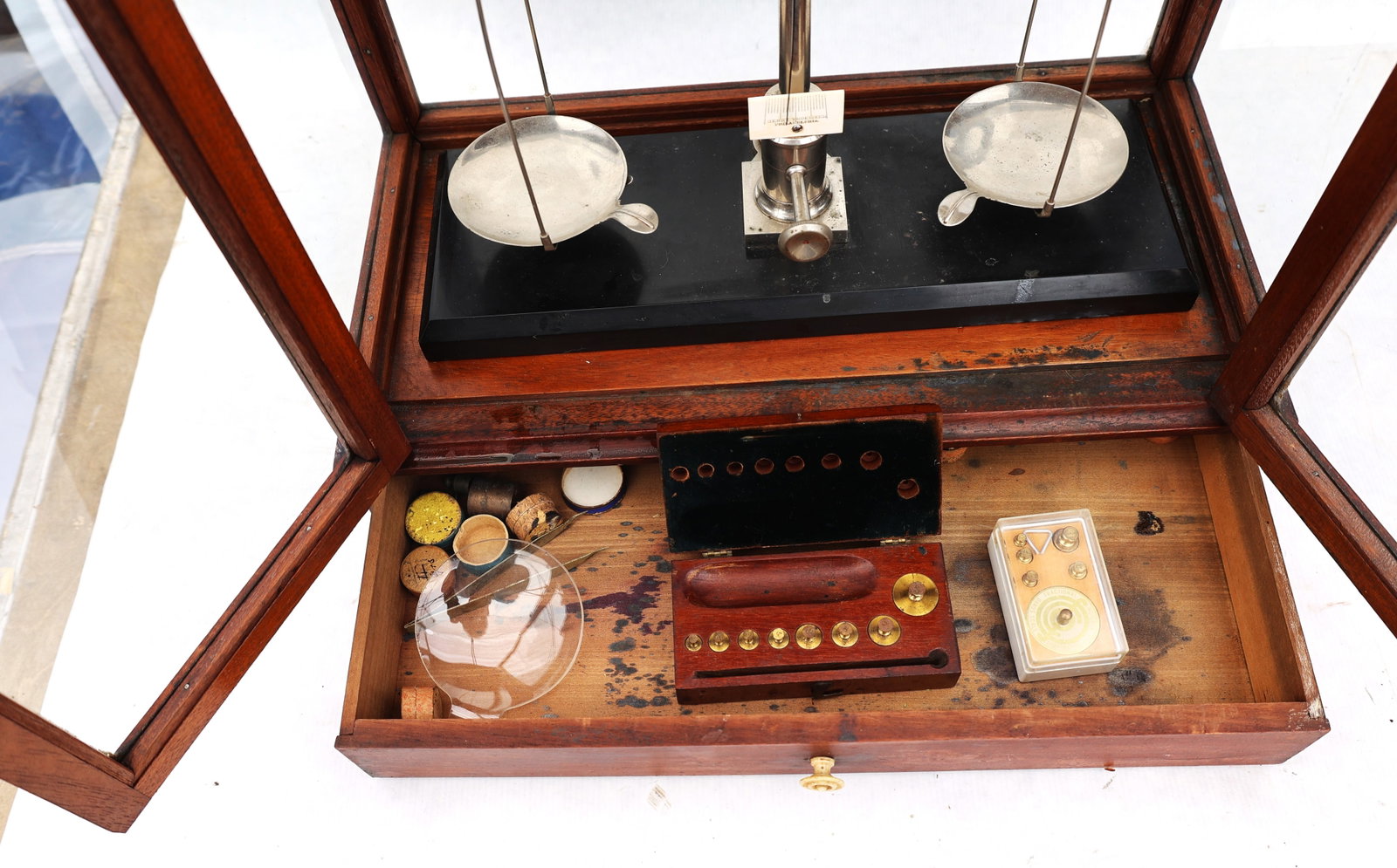 antique mahogany-cased balance scale features a vertical sliding glass door and a lower storage draw - 2