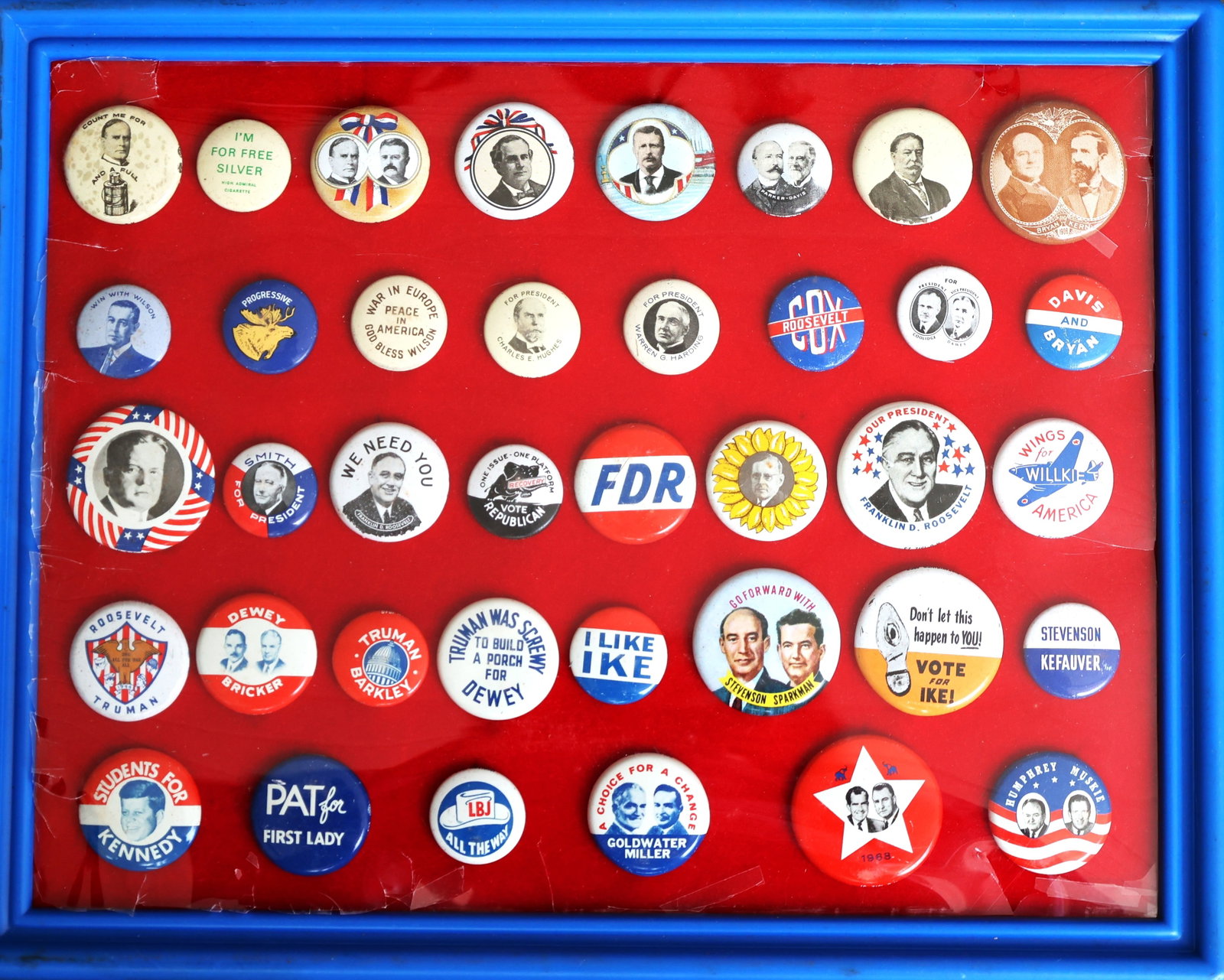 collection of politcal buttons in a display case - variety (1 of 7)