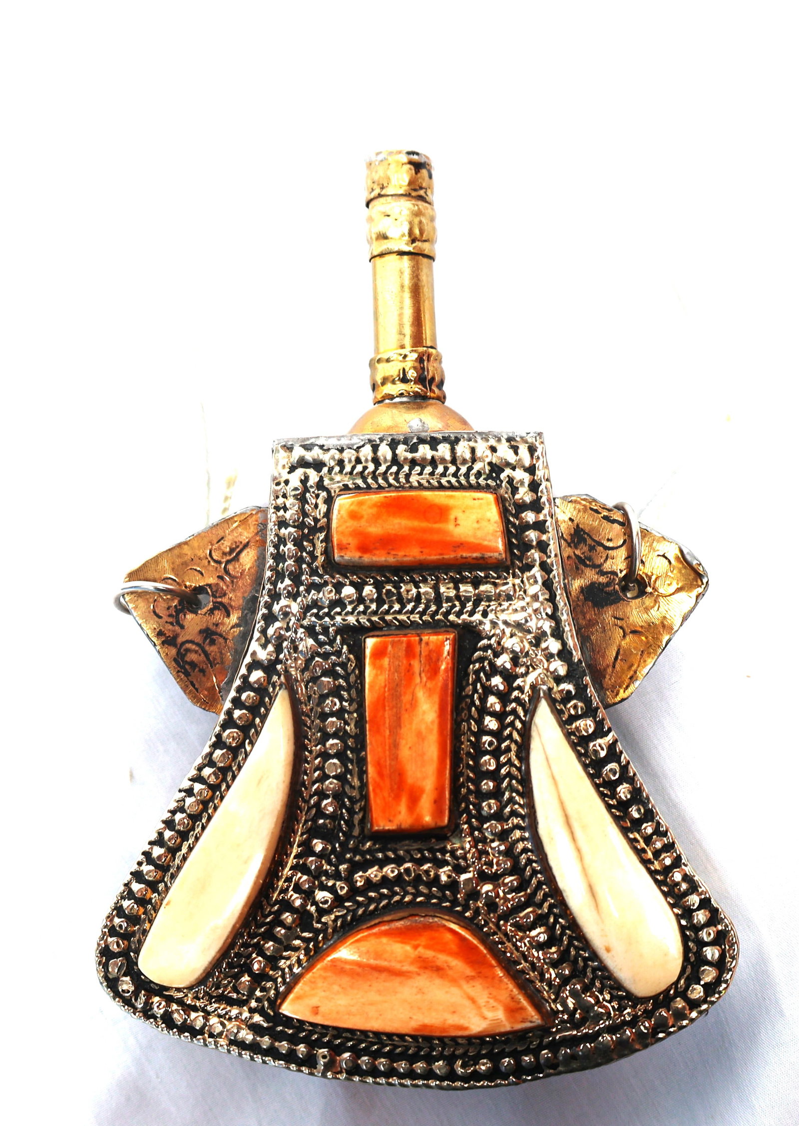 vintage Moroccan gunpowder flask featuring intricate metalwork and bone inlay. (1 of 5)