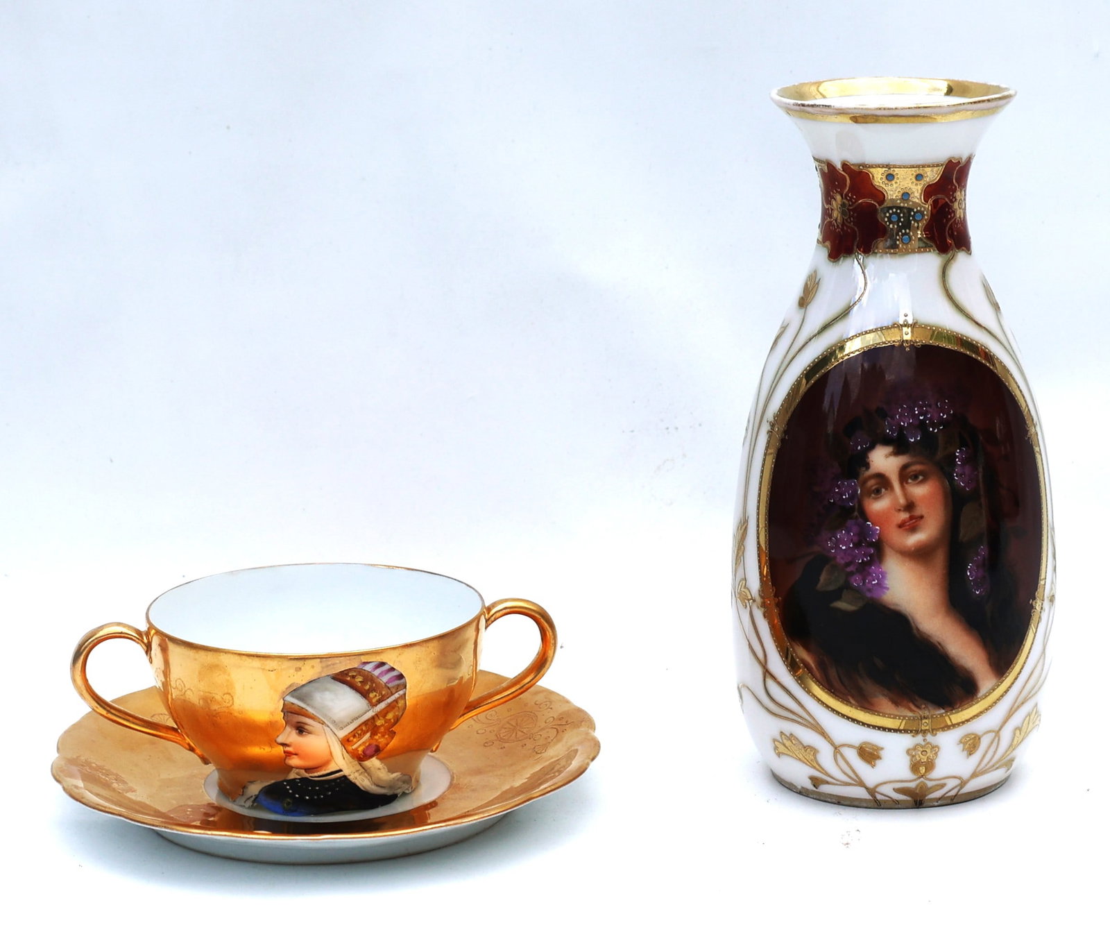 late 19th or early 20th-century Royal Vienna-style hand-painted porcelain.The items feature detailed: Size: 7 1/4 in. height x 3 1/4 in. bulbous and 5 3/4 in. dia. saucer; 2 in. x 3 1/2 in. cup ; late 19th or early 20th-century Royal Vienna-style hand-painted porcelain.The items feature detailed femal
