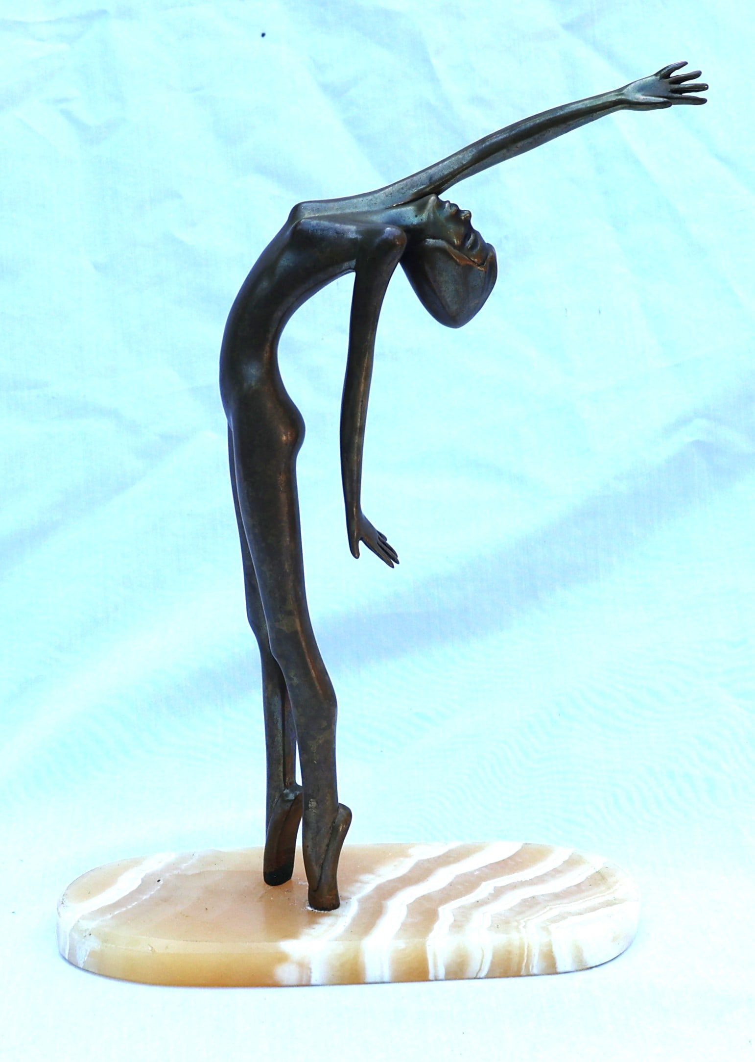 vintage bronze dancer statue featuring a slender, stylized figure in a dramatic arching pose.It sit (1 of 9)