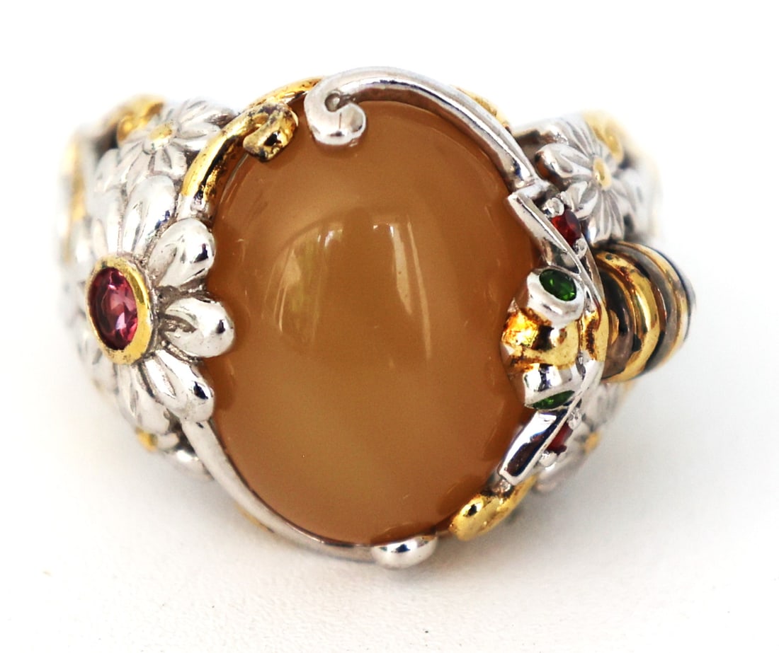 .925 Sterling Silver Chalcedony Center Stone with Flower, Pink Tourmaline Ring Size 8: .925 Sterling Silver Chalcedony Center Stone with Flower, Pink Tourmaline in the Center and a Bee with Emerald Eyes, Ruby Wings, all have Gold Accents. Ring Size 8 ; 7/8 in. x 3/4 in.