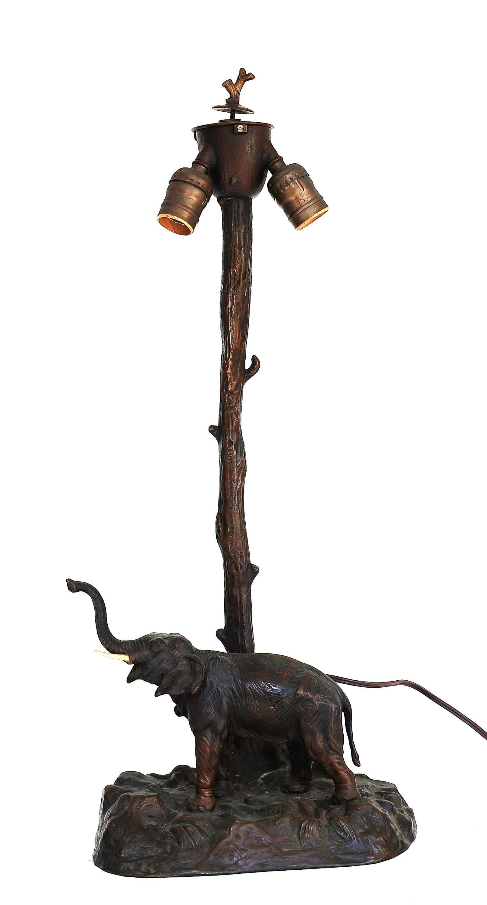 antique bronze lamp features a whimsical elephant standing beside a tree trunk designed by Maitland (1 of 11)