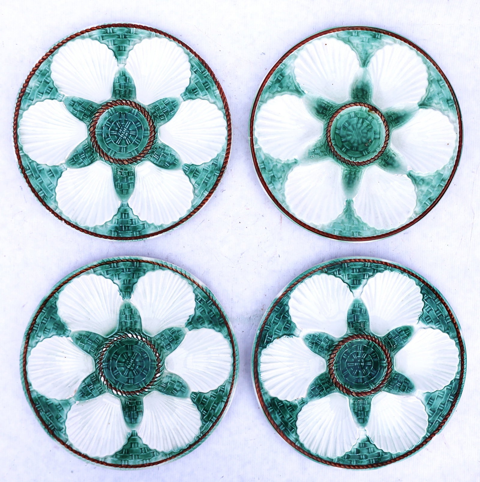 Set of 4 Vintage French Majolica oyster plates featuring a green basketweave design and white shells (1 of 5)