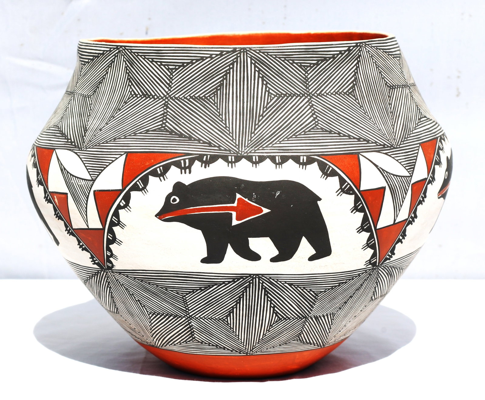 vintage Acoma polychrome olla featuring a heartline bear design.Origin: Acoma Pueblo, New Mexico.Des: Size: 8 in. height x 7.5 in. top x 9.5 in. bulbous ; vintage Acoma polychrome olla featuring a heartline bear design.Origin: Acoma Pueblo, New Mexico.Design: Features geometric black-on-white patterns