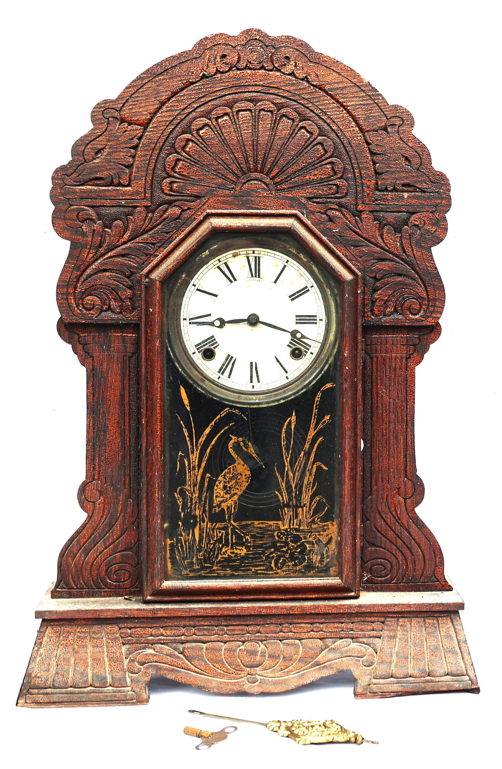 antique Sessions gingerbread mantel clock with intricate carved woodwork and a glass panel depictin (1 of 8)
